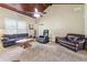 Spacious living room with vaulted ceilings, comfortable leather seating, and lots of natural light at 3280 Pebble Hill Dr, Marietta, GA 30062