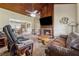 Inviting living room with wood ceiling, brick fireplace, and comfortable seating area at 3280 Pebble Hill Dr, Marietta, GA 30062