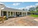 Backyard patio offers a relaxing outdoor space with access to the house via multiple glass doors at 3280 Pebble Hill Dr, Marietta, GA 30062