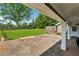 Covered outdoor patio overlooking a large, fenced backyard, providing a comfortable retreat at 3280 Pebble Hill Dr, Marietta, GA 30062