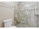 Close-up of a tiled walk-in shower with a glass door and modern fixtures at 3280 Pebble Hill Dr, Marietta, GA 30062