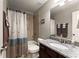 Full bathroom with granite countertop vanity, shower-tub combo, and neutral colors at 4665 Idlewood Dr, Cumming, GA 30040