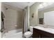 Modern bathroom featuring a tiled shower, vanity, and fixtures at 4665 Idlewood Dr, Cumming, GA 30040