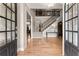 Elegant foyer featuring hardwood floors, a grand staircase, and a view into the adjacent dining and living areas at 4665 Idlewood Dr, Cumming, GA 30040
