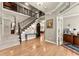 Inviting foyer showcases hardwood floors, a staircase, and an office with French doors to the right at 4665 Idlewood Dr, Cumming, GA 30040