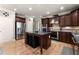 Stylish kitchen features stainless steel appliances, granite countertops, a central island, and hardwood floors at 4665 Idlewood Dr, Cumming, GA 30040