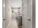 Convenient laundry room with modern appliances and storage shelves at 4665 Idlewood Dr, Cumming, GA 30040