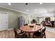 Bright living room with hardwood floors, stainless steel refrigerator, and plush carpet at 4665 Idlewood Dr, Cumming, GA 30040