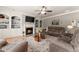Cozy living room features a fireplace with built-in shelving, hardwood floors, and comfortable seating at 4665 Idlewood Dr, Cumming, GA 30040