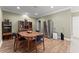Open dining area, stainless steel refrigerator, and seamless flooring at 4665 Idlewood Dr, Cumming, GA 30040