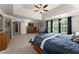 Spacious primary bedroom with a tray ceiling and large windows at 4665 Idlewood Dr, Cumming, GA 30040