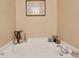 Corner bathtub with neutral decor, perfect for relaxation and creating a spa-like atmosphere at 630 Birch River Ln, Lawrenceville, GA 30043
