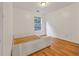 Cozy bedroom features natural light from the window and hardwood floors at 630 Birch River Ln, Lawrenceville, GA 30043