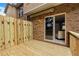 Back deck area with wood fence and sliding glass door at 630 Birch River Ln, Lawrenceville, GA 30043