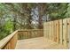 Spacious wood deck with wooden fence and green trees at 630 Birch River Ln, Lawrenceville, GA 30043