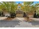 Inviting brick townhome featuring a 2-car garage and well-maintained landscaping at 630 Birch River Ln, Lawrenceville, GA 30043
