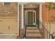 Stylish front entrance featuring a brick facade, leading to a welcoming front door at 630 Birch River Ln, Lawrenceville, GA 30043