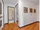 Spacious hallway featuring hardwood flooring, neutral paint, and access to multiple rooms at 630 Birch River Ln, Lawrenceville, GA 30043
