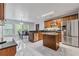 Bright kitchen with stainless steel appliances, granite countertops, an island, and a breakfast area at 630 Birch River Ln, Lawrenceville, GA 30043