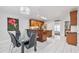 Stylish kitchen featuring granite countertops, stainless steel appliances, breakfast bar, and tile flooring at 630 Birch River Ln, Lawrenceville, GA 30043