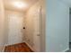Entryway featuring neutral walls, wood-look flooring, and a white front door at 6304 Kendra Ln, Lithonia, GA 30058