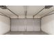 Spacious two car garage with two automatic door openers and a concrete floor at 6304 Kendra Ln, Lithonia, GA 30058