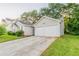 The property includes a spacious two-car garage and concrete driveway at 6304 Kendra Ln, Lithonia, GA 30058