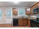Bright kitchen featuring stainless steel appliances, light countertops, and wood-look flooring at 6304 Kendra Ln, Lithonia, GA 30058