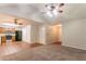 Spacious living room featuring vaulted ceilings, ceiling fans and new flooring at 6304 Kendra Ln, Lithonia, GA 30058