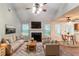 Inviting living room with vaulted ceiling, fireplace, neutral tones, and hardwood floors at 6304 Kendra Ln, Lithonia, GA 30058