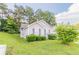 This single-Gathering home features a well-maintained lawn and charming curb appeal at 6304 Kendra Ln, Lithonia, GA 30058