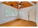 Bedroom featuring hardwood floors, wood-paneled vaulted ceiling, and plantation shutters at 1640 Nottingham Ne Way, Atlanta, GA 30309