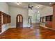 Expansive walk-in closet with hardwood floors, built-in shelving, and a dark wood accent door at 1640 Nottingham Ne Way, Atlanta, GA 30309