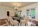 Beautiful dining room with hardwood floors, chandelier, and French doors leading to the outdoors at 1640 Nottingham Ne Way, Atlanta, GA 30309