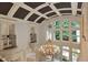 A soaring two-story foyer features a large chandelier and plenty of natural light from a large window at 1640 Nottingham Ne Way, Atlanta, GA 30309