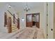 Spacious foyer with staircase, wood and tile flooring, chandelier, and bar at 1640 Nottingham Ne Way, Atlanta, GA 30309
