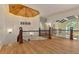 Open hallway with wood floors, custom wood railing, and decorative wood plank ceiling at 1640 Nottingham Ne Way, Atlanta, GA 30309