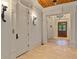 Hallway featuring stone floors, paneled wood doors, and decorative light fixtures at 1640 Nottingham Ne Way, Atlanta, GA 30309