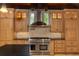 Gourmet kitchen with custom cabinets, stainless steel appliances, and brick backsplash at 1640 Nottingham Ne Way, Atlanta, GA 30309