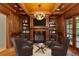 Elegant living room features a wood-paneled ceiling, fireplace, TV, and comfortable seating at 1640 Nottingham Ne Way, Atlanta, GA 30309