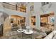 Spacious living area with hardwood and stone accents, leading to the kitchen and staircase at 1640 Nottingham Ne Way, Atlanta, GA 30309
