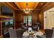 Sophisticated living room boasts a wood-paneled ceiling, fireplace, and view to the outdoors at 1640 Nottingham Ne Way, Atlanta, GA 30309