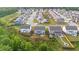 Aerial of homes in a neighborhood featuring green lawns, backyard patios, and community landscaping at 116 Eleanora Park, Loganville, GA 30052