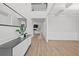 Bright entryway with tall ceilings, hardwood floors, console table and open access to living area at 116 Eleanora Park, Loganville, GA 30052