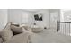 Upstairs loft is carpeted with large sectional and TV at 116 Eleanora Park, Loganville, GA 30052