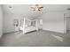 Spacious main bedroom featuring vaulted ceiling and a large bed with decorative canopy at 116 Eleanora Park, Loganville, GA 30052