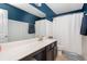 Stylish bathroom with double vanity, modern fixtures, and ample natural light at 319 Nobleman Way, Canton, GA 30114