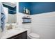 Modern bathroom with stylish vanity, white shiplap walls, and a shower at 319 Nobleman Way, Canton, GA 30114