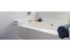 Close-up of bathtub featuring chrome fixtures and a neutral-toned wall at 319 Nobleman Way, Canton, GA 30114