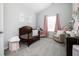 Cozy Bedroom with crib, glider, and soft decor for a comforting space at 319 Nobleman Way, Canton, GA 30114